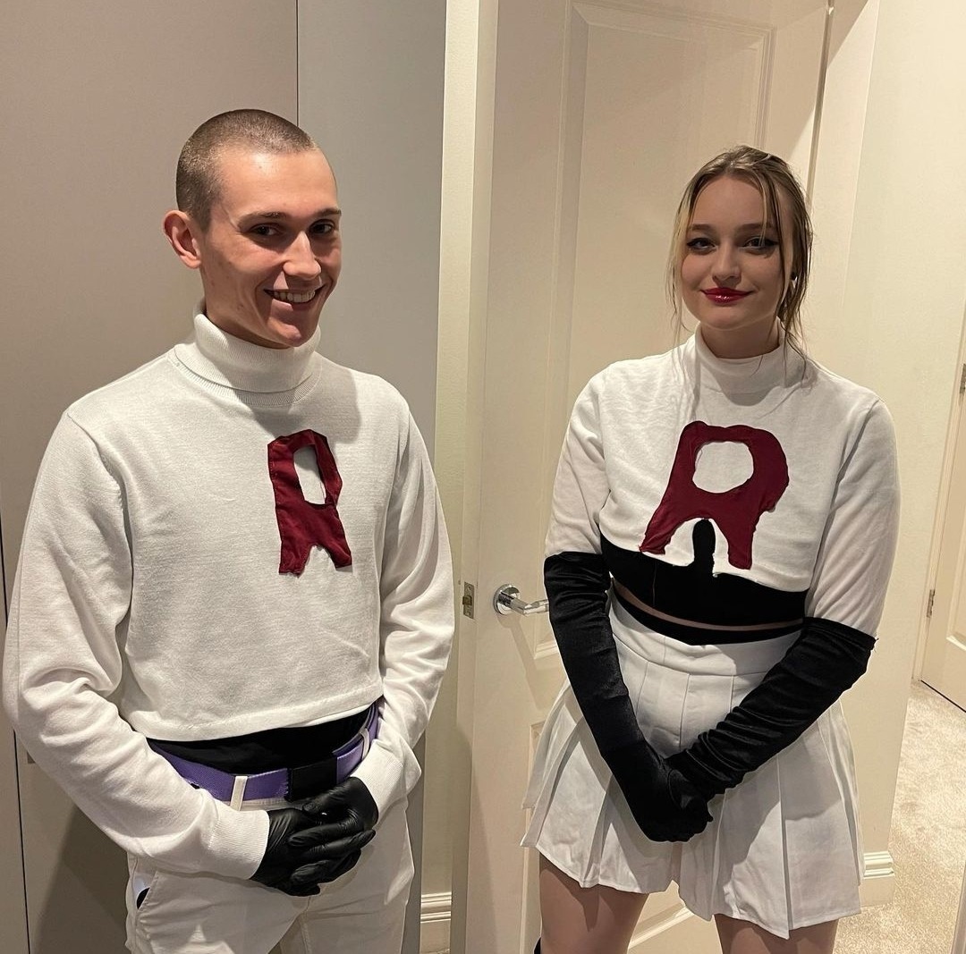 This is a photo of the real life content creators Nihachu and Jack Manifold. They are wearing home-made Team Rocket costumes for Halloween.